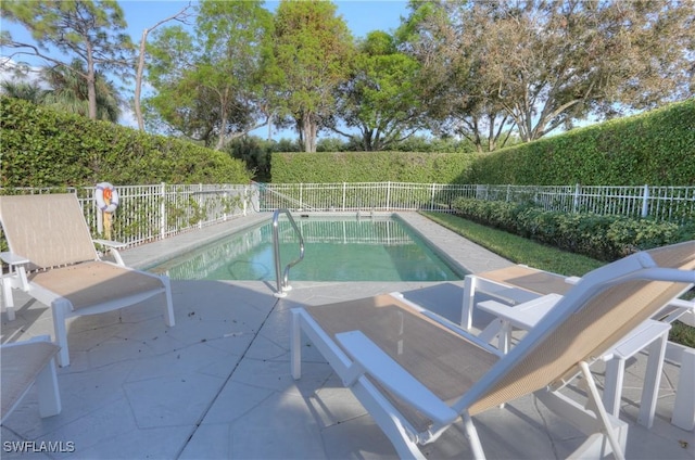 486 Edgemere Way E Unit 2-3, Naples, FL 34105 - view of swimming pool featuring a fenced backyard and a patio