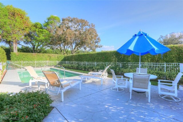 486 Edgemere Way E Unit 2-3, Naples, FL 34105 - fenced backyard with a patio area