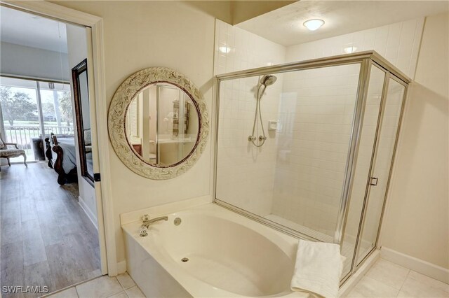 486 Edgemere Way E Unit 2-3, Naples, FL 34105 - bathroom featuring a shower stall and a garden tub