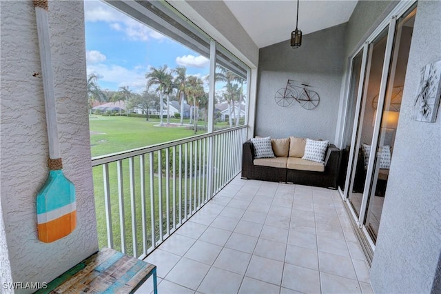 unfurnished sunroom featuring lofted ceiling