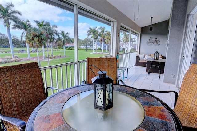 486 Edgemere Way E Unit 2-3, Naples, FL 34105 - sunroom / solarium with lofted ceiling and outdoor dining area