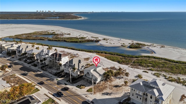 aerial view featuring a water view and a beach view