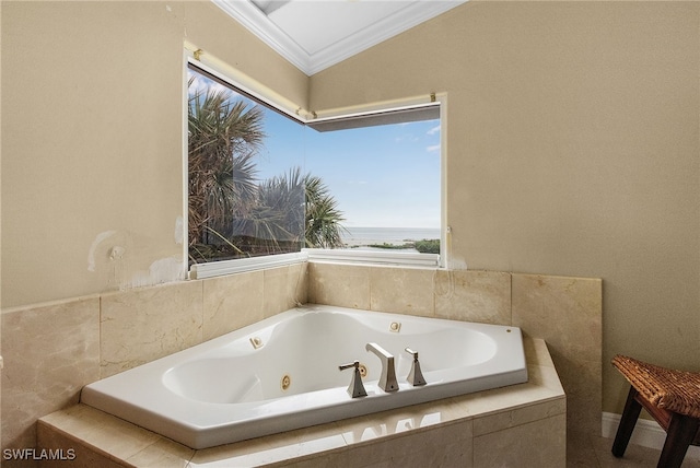 bathroom with a relaxing tiled tub and ornamental molding