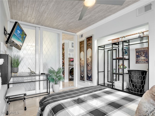 bedroom with ceiling fan, ornamental molding, and washer / clothes dryer