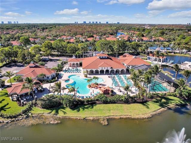 birds eye view of property with a water view