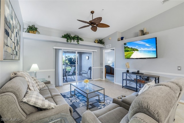 living room featuring ceiling fan, light tile patterned floors, and lofted ceiling