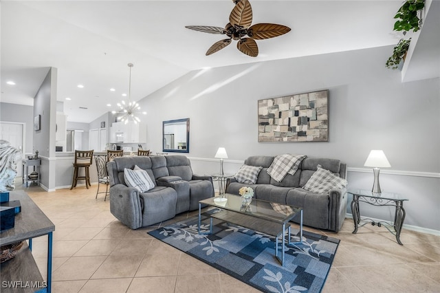 living room featuring ceiling fan with notable chandelier, lofted ceiling, and light tile patterned floors