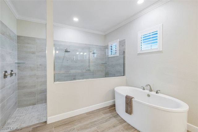 bathroom with separate shower and tub and crown molding