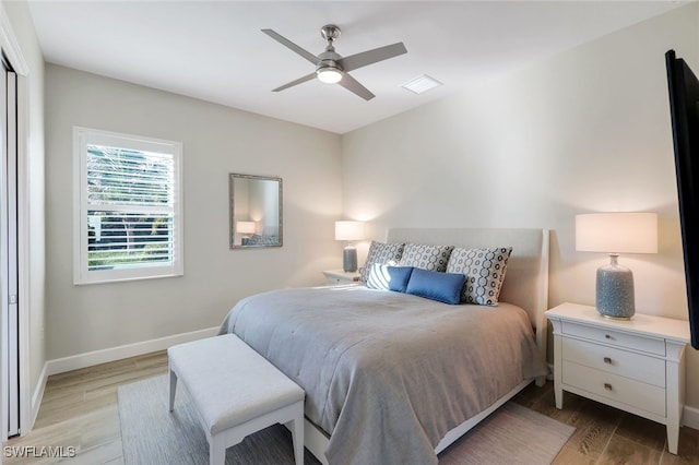 bedroom featuring ceiling fan and light wood-type flooring