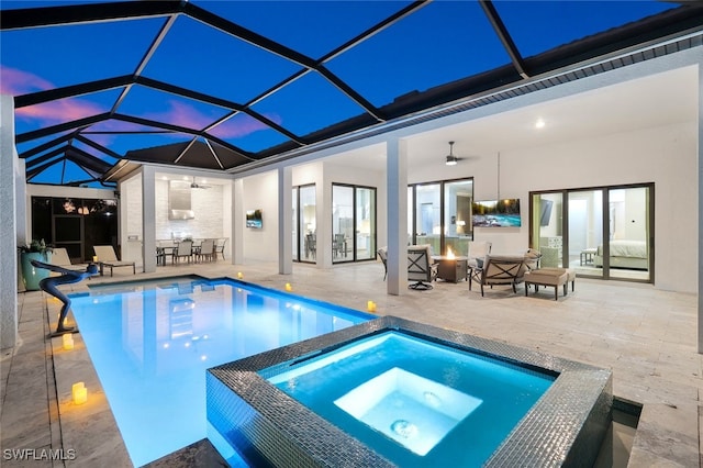 view of swimming pool featuring a lanai, a patio area, ceiling fan, and an in ground hot tub