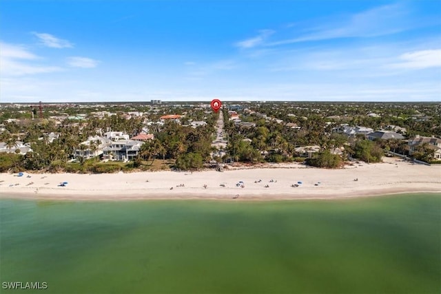 birds eye view of property with a view of the beach and a water view