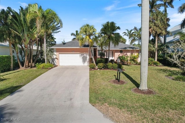 ranch-style home with a front yard and a garage