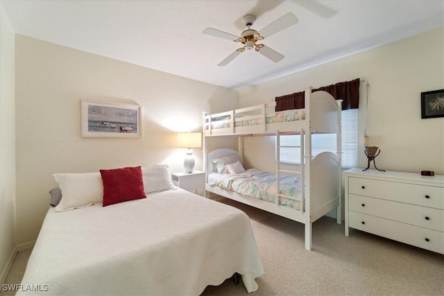 bedroom with light carpet and ceiling fan