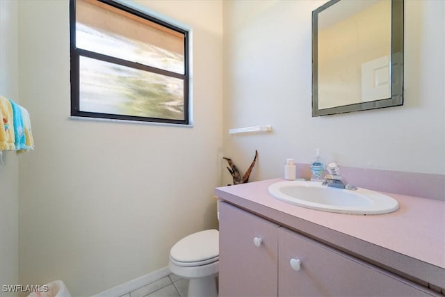 bathroom with tile patterned floors, vanity, and toilet