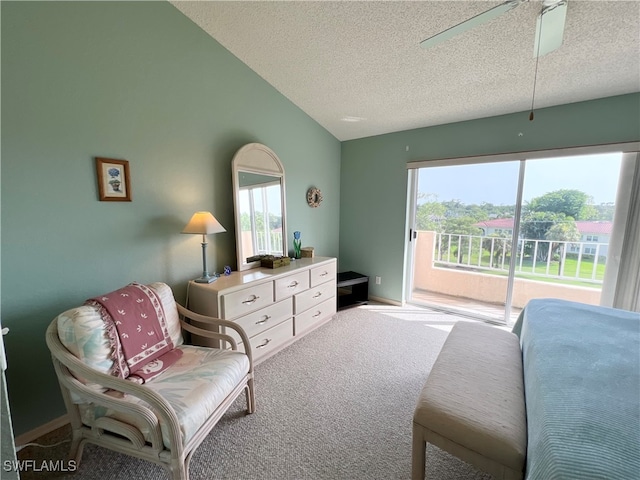 living area featuring vaulted ceiling, ceiling fan, light colored carpet, and a textured ceiling