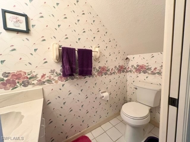 bathroom with tile patterned floors and toilet