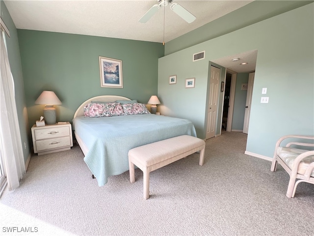 bedroom featuring light colored carpet and ceiling fan