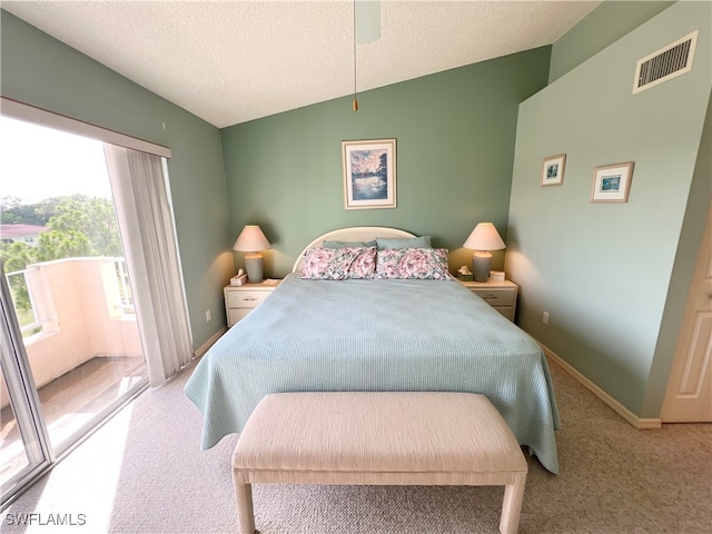 bedroom with carpet flooring, ceiling fan, a textured ceiling, and vaulted ceiling