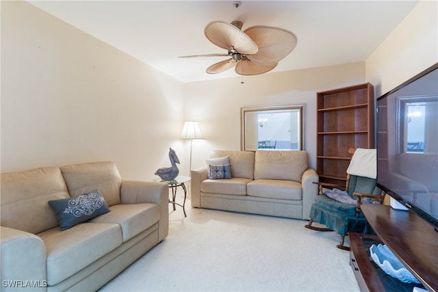 living room featuring light colored carpet and ceiling fan