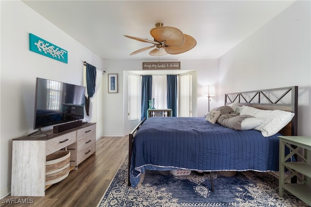 bedroom featuring ceiling fan and dark wood-type flooring