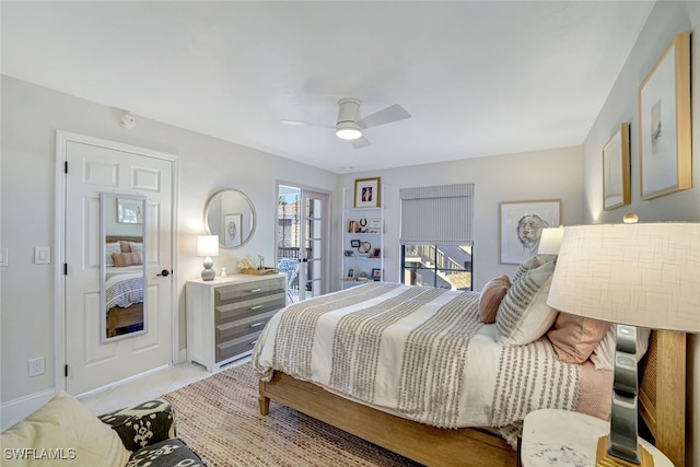 bedroom with multiple windows and ceiling fan