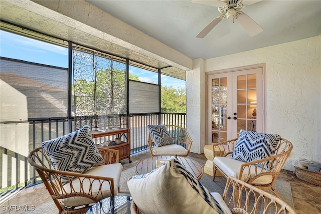 sunroom featuring a wealth of natural light, french doors, and ceiling fan