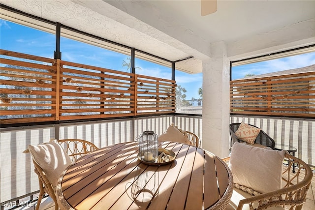 sunroom / solarium with ceiling fan