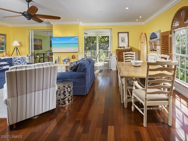 dining room with dark hardwood / wood-style flooring, plenty of natural light, and crown molding