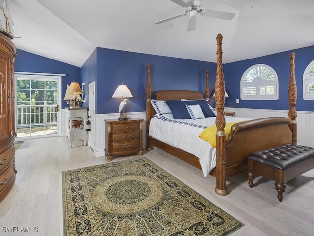 bedroom with access to outside, ceiling fan, hardwood / wood-style floors, and lofted ceiling