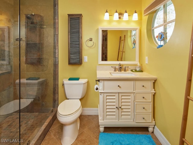 bathroom with a tile shower, tile patterned flooring, vanity, and toilet