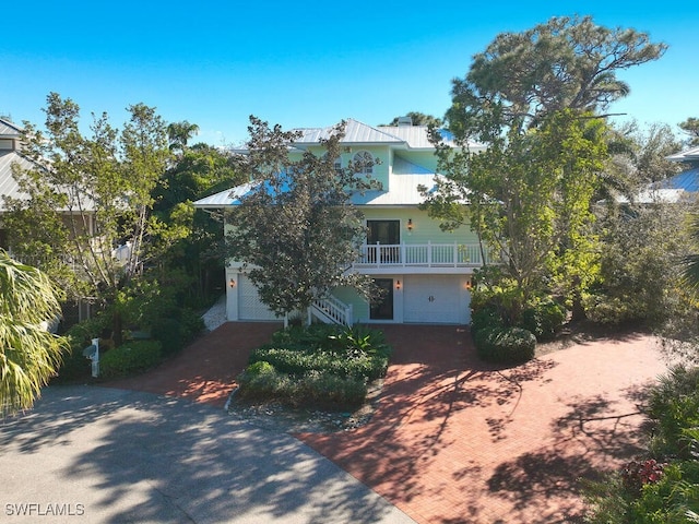 obstructed view of property with a garage