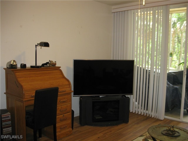 office space with wood-type flooring