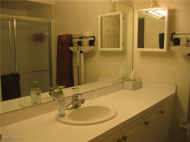 bathroom with vanity and an enclosed shower