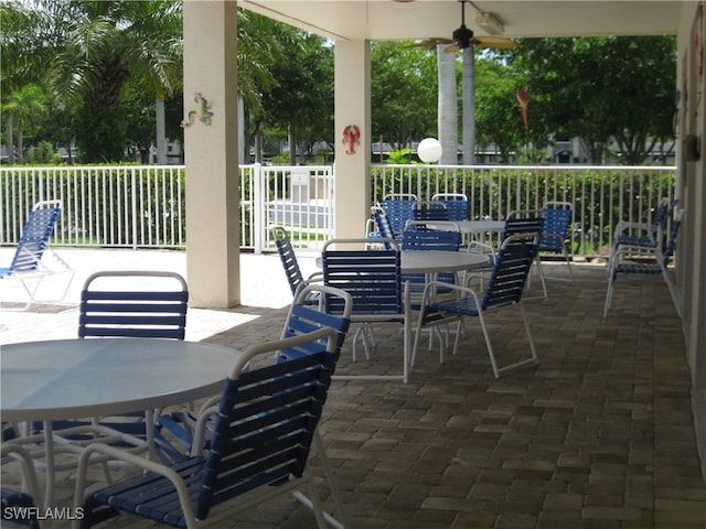 view of patio featuring ceiling fan