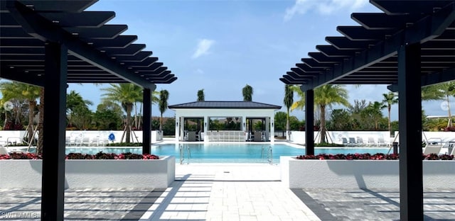 1111 Central Ave Unit 211, Naples, FL 34102 - community pool with a pergola and a patio