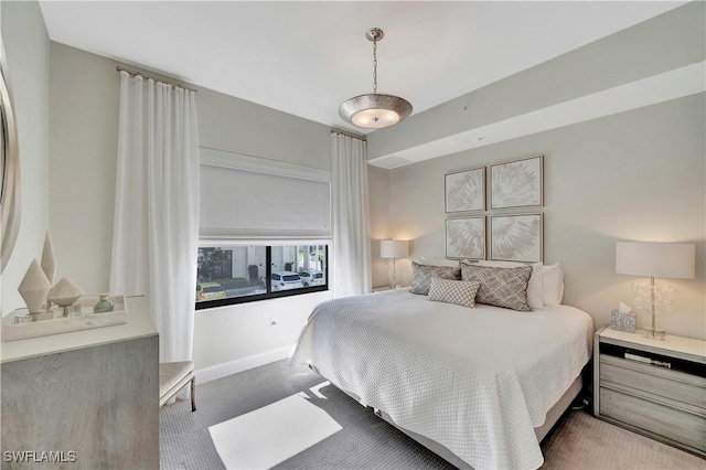 bedroom with light colored carpet