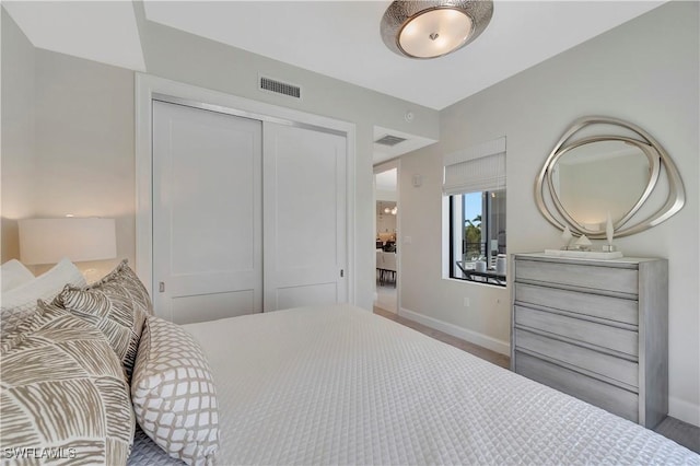 1111 Central Ave Unit 211, Naples, FL 34102 - bedroom featuring a closet and baseboards