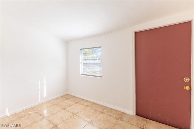 spare room with light tile patterned floors