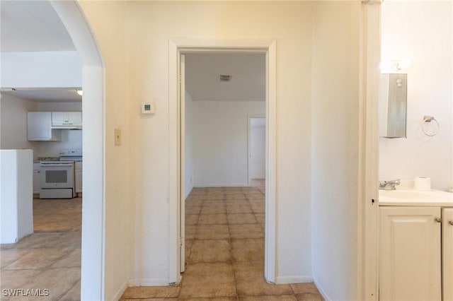 hallway featuring sink