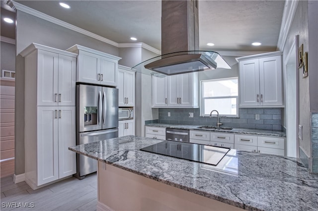 kitchen featuring white cabinetry, island range hood, sink, and stainless steel appliances