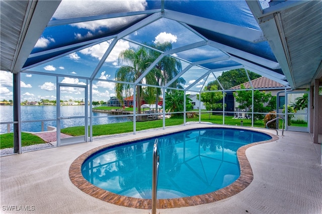 view of pool featuring a lanai, a patio area, and a water view