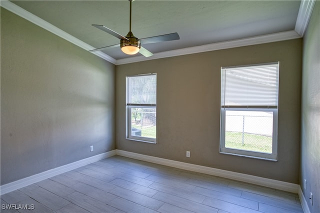 empty room with light hardwood / wood-style flooring, ceiling fan, and crown molding