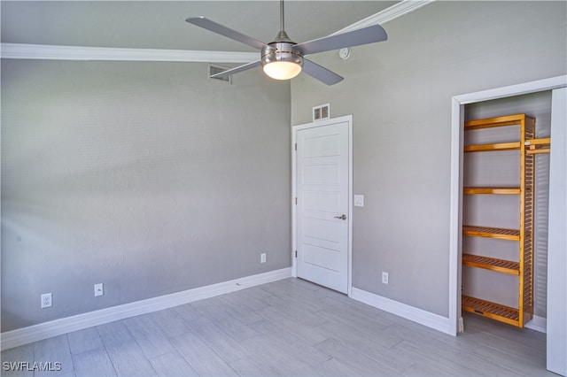 unfurnished bedroom with ceiling fan, light hardwood / wood-style floors, and crown molding