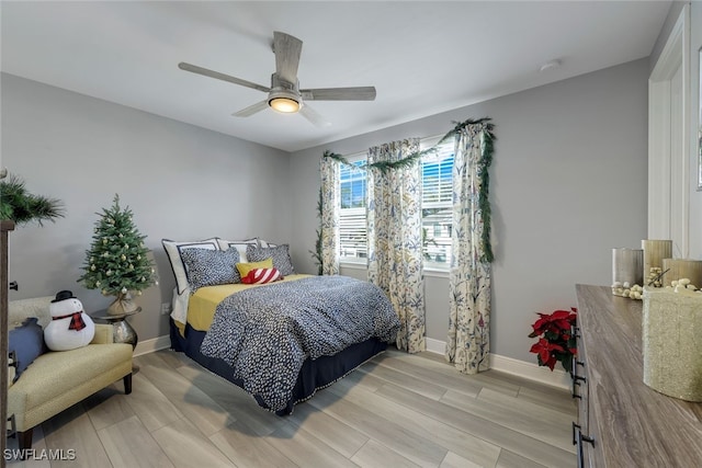 bedroom featuring ceiling fan and light hardwood / wood-style flooring