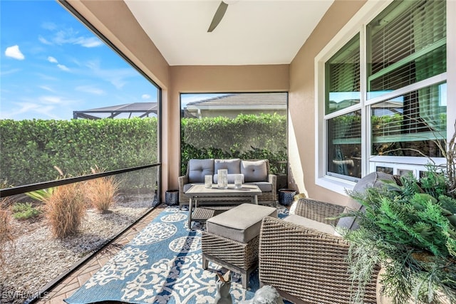 sunroom with ceiling fan