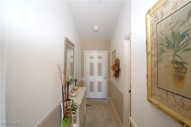 entryway with light tile patterned floors