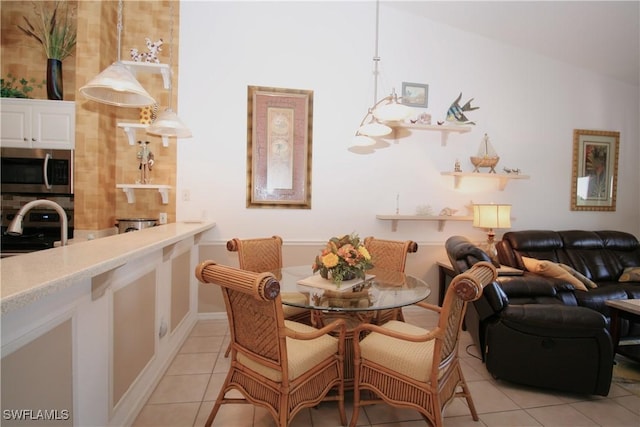 tiled dining area with sink