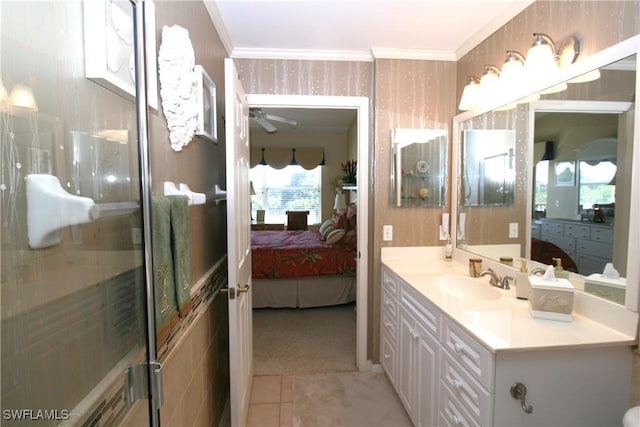 bathroom with tile patterned floors, ceiling fan, vanity, and ornamental molding