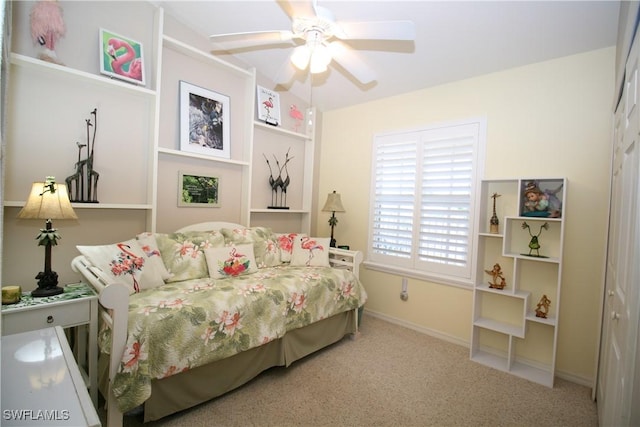 bedroom featuring ceiling fan, a closet, and carpet