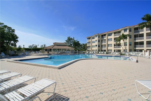 view of swimming pool with a patio